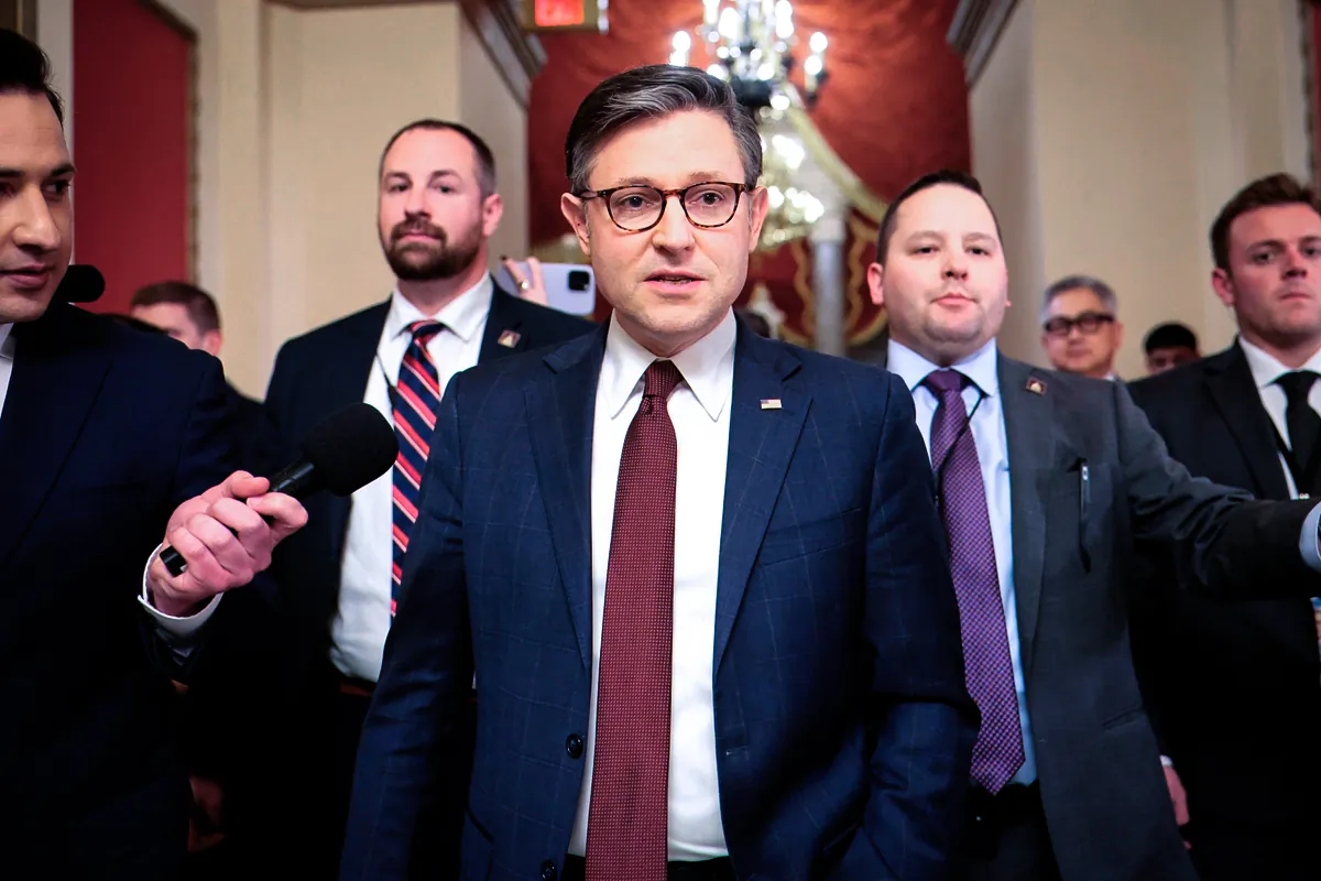 Speaker of the House Mike Johnson (R-La.) speaks with press while walking into the House Chambers to vote in Washington on Feb. 25, 2025. (Kayla Bartkowski/Getty Images)