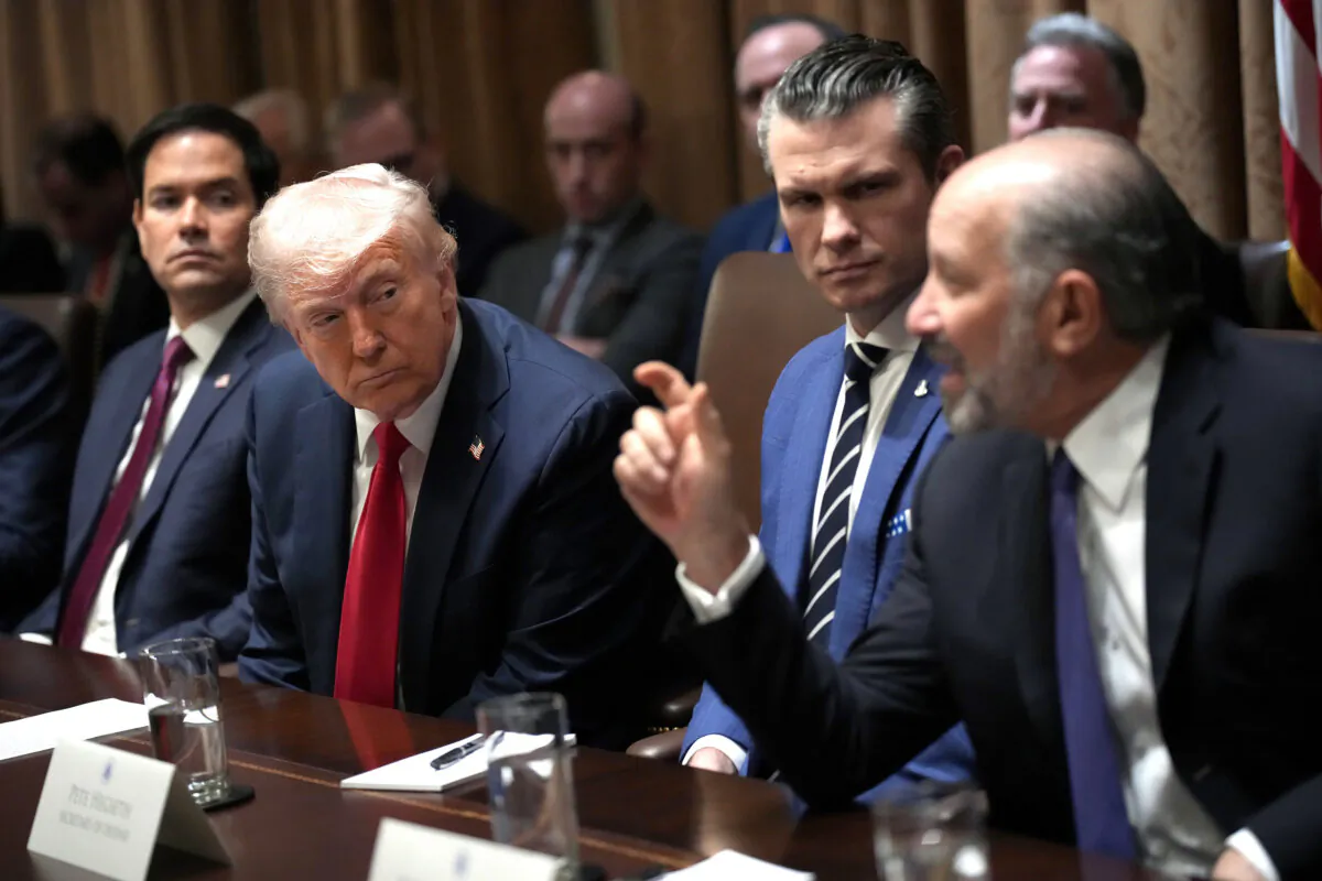 President Donald Trump listens as Commerce Secretary Howard Lutnick delivers remarks at a Cabinet meeting at the White House on Feb. 26, 2025. (Andrew Harnik/Getty Images)