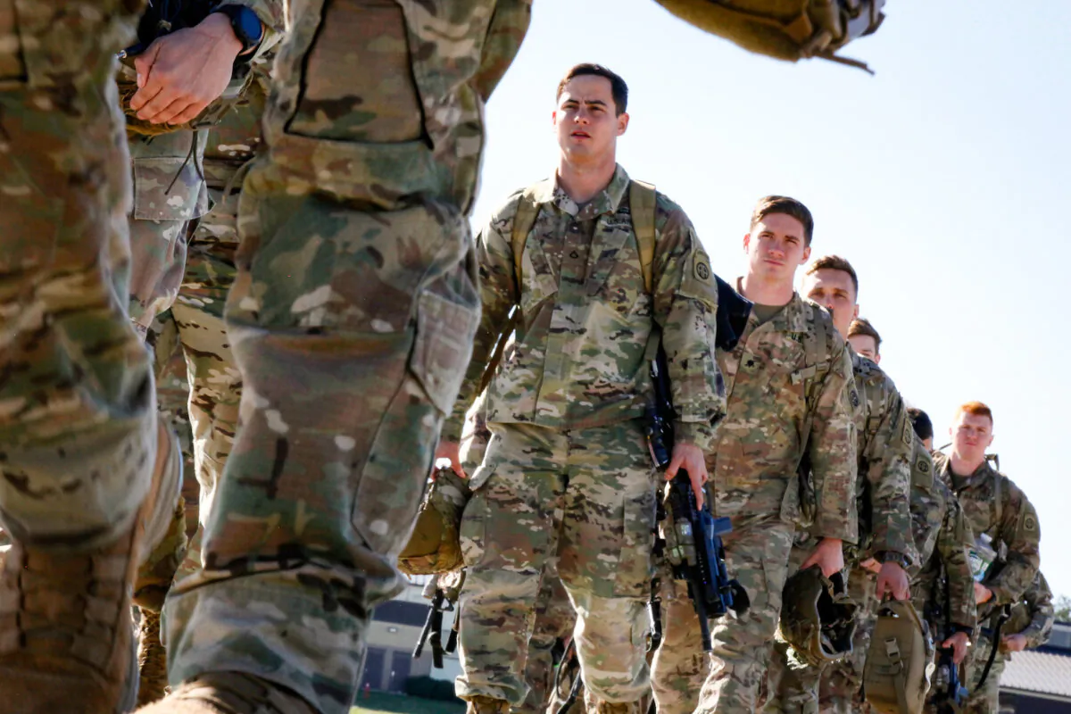 U.S. Army paratroopers assigned to 1st Brigade Combat Team, 82nd Airborne Division, board an aircraft bound for the U.S. Central Command area of operations from Fort Bragg, N.C., on Jan. 5, 2020. (U.S. Army/Spc. Hubert Delany III/Handout via Reuters)