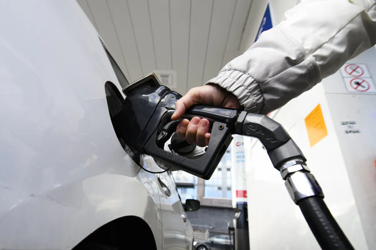 A woman pumps gas at a gas station in Mississauga, Ont., on Feb. 13, 2024. (The Canadian Press/Christopher Katsarov)