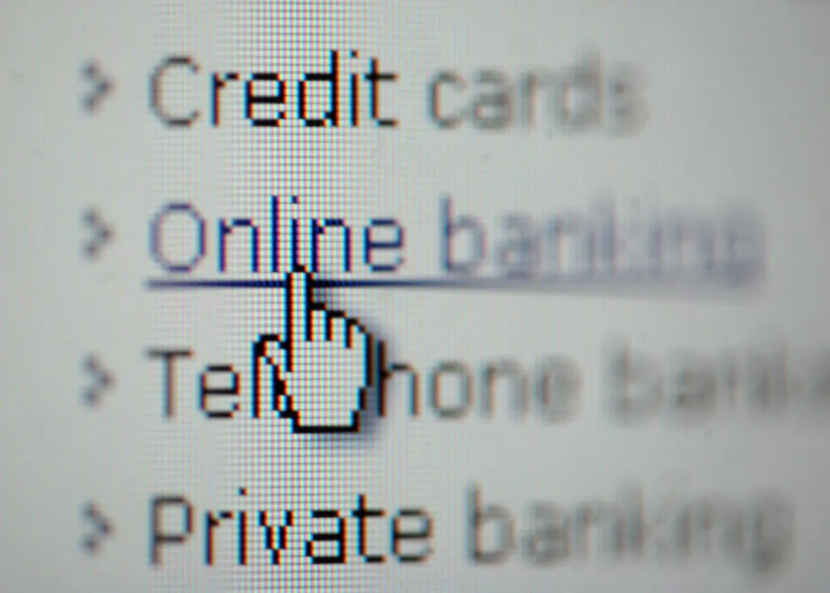 A close-up of a web page, with the pointer over the word 'online banking,' in an undated file photo. (PA)