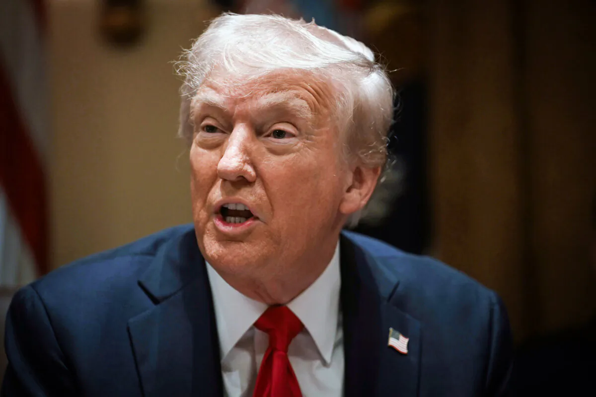 President Donald Trump holds his first Cabinet meeting at the White House in Washington on Feb. 26, 2025. (Pool via AP)