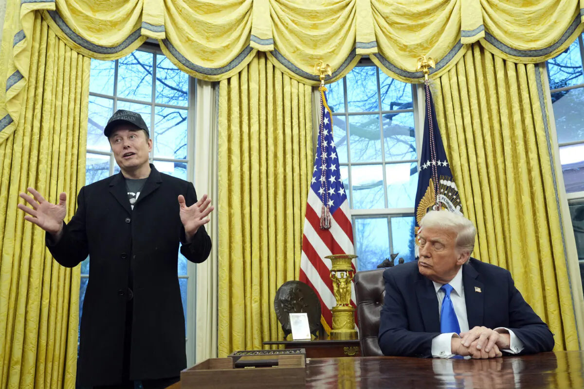 President Donald Trump listens as Elon Musk speaks in the Oval Office on Feb. 11, 2025. (Photo/Alex Brandon)