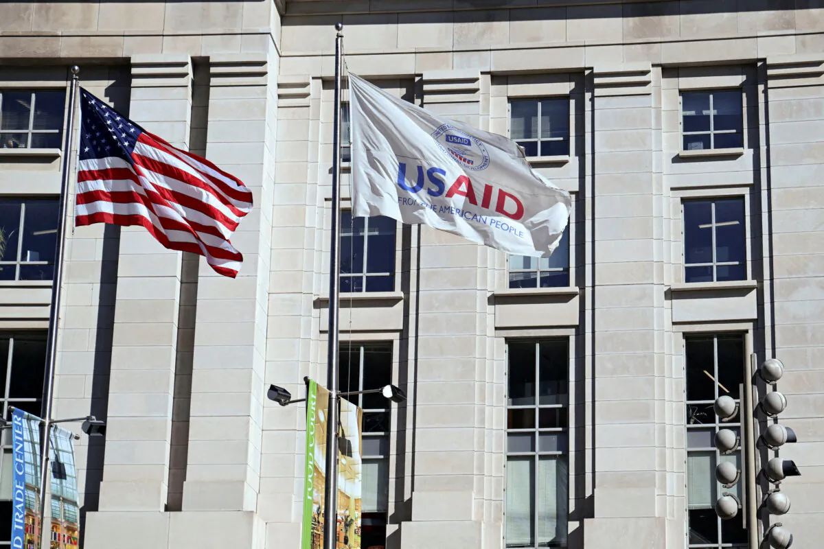 An American flag and USAID flag fly outside the USAID building in Washington on Feb. 1, 2025. (Annabelle Gordon/Reuters)