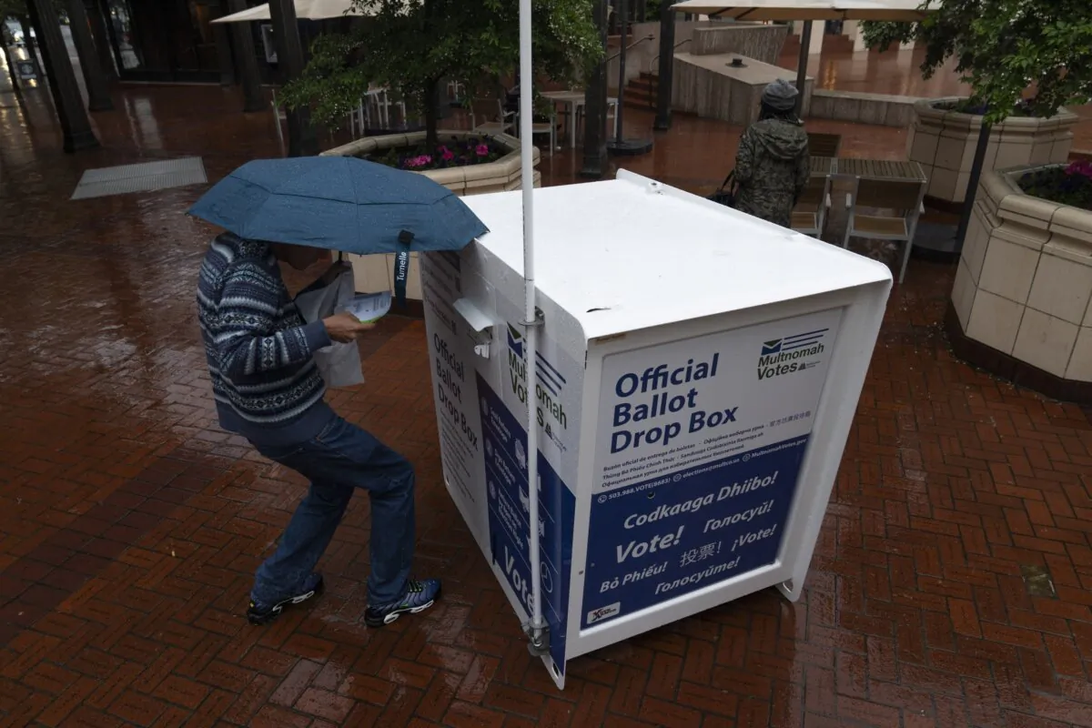 A person drops off their vote-by-mail ballot at a dropbox in Portland, Ore., on May 21, 2024. (Jenny Kane / AP Photo, File)