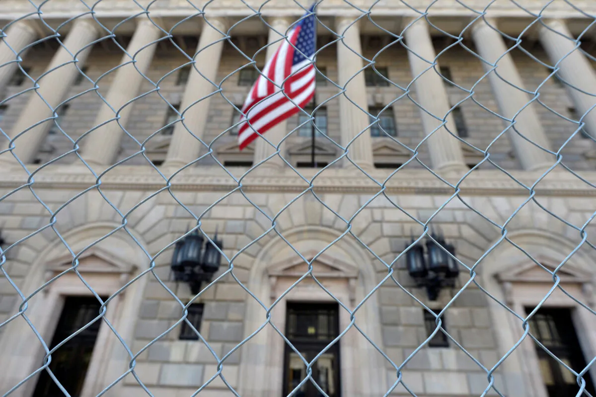 A fence surrounds the U.S. Department of Commerce in Washington October 5, 2013, as the government shutdown continues into the weekend. (Mike Theiler/Reuters)
