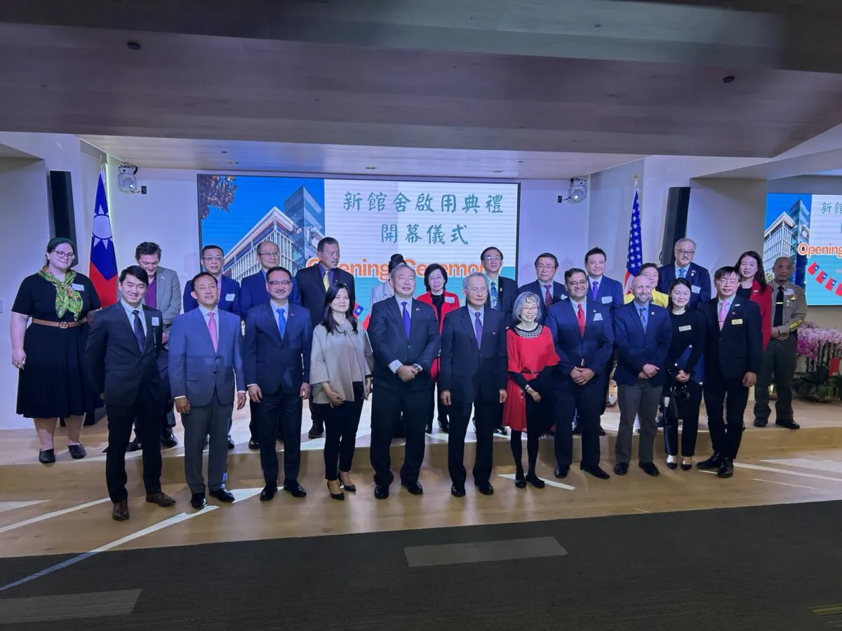 Alexander Tah-ray Yui (front, 5th L), Ming-Chi Scott Lai (front, 6th L), and Ruan Jhao-syong (front, 3rd L) at the opening ceremony of the new TECO office building on Feb. 27, 2025. (Nathan Su/The Epoch Times)