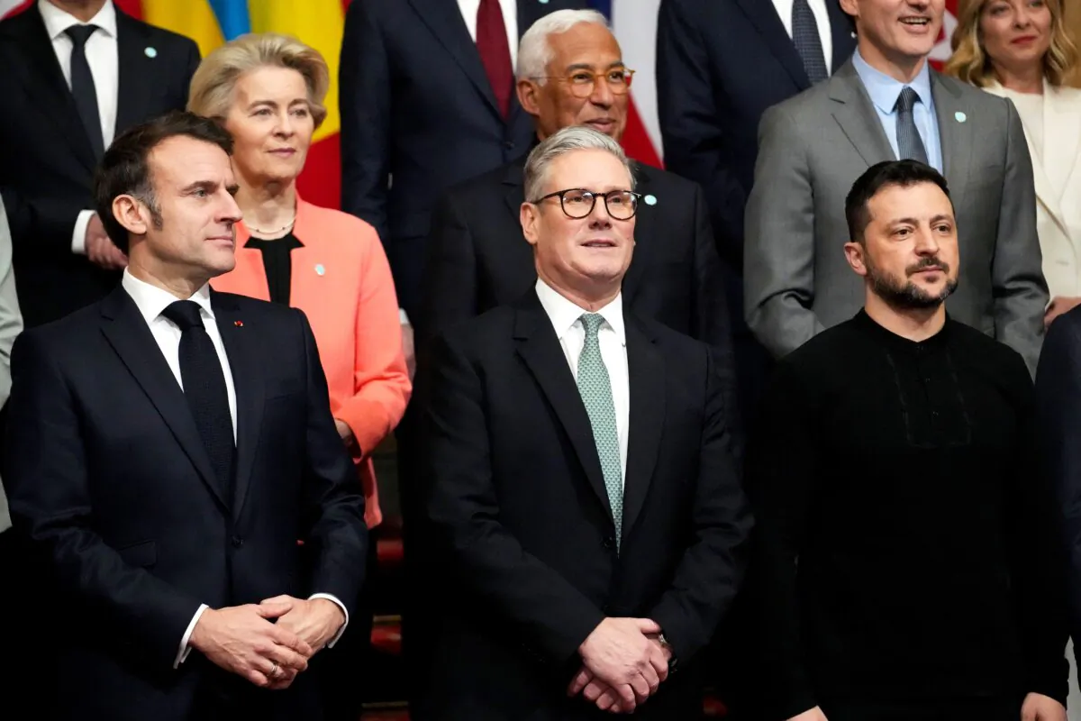 (L–R) France's President Emmanuel Macron, Britain's Prime Minister Keir Starmer and Ukraine's President Volodymyr Zelenskyy pose for a family photograph during a summit held at Lancaster House in central London on March 2, 2025. (Christophe Ena/Pool/AFP via Getty Images)