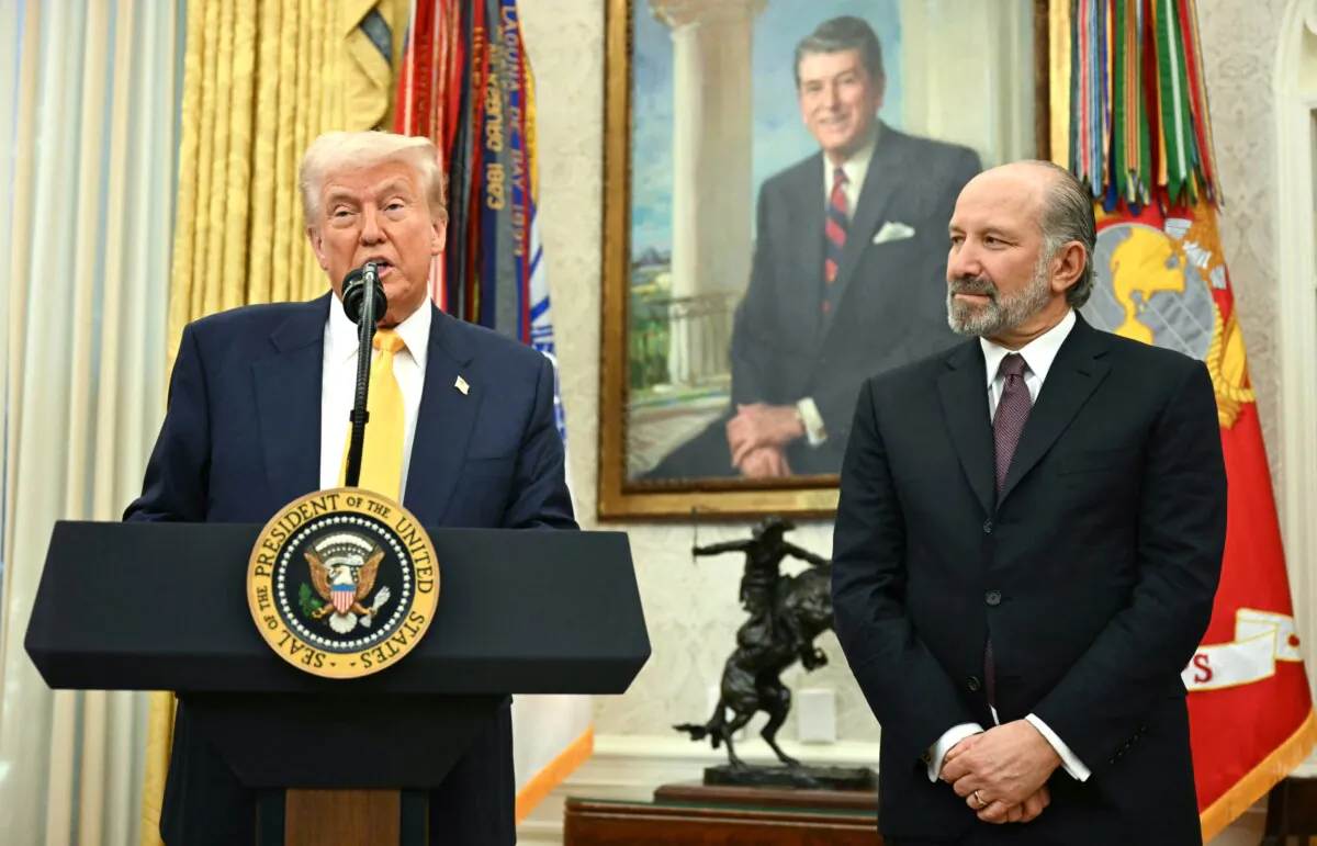 President Donald Trump speaks during a ceremonial swearing-in for Secretary of Commerce Howard Lutnick (R) in the Oval Office of the White House on Feb. 21, 2025. (Jim Watson/AFP via Getty Images)