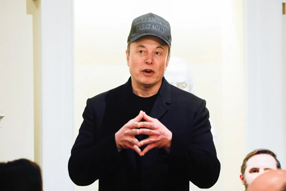 Elon Musk speaks during a cabinet meeting with President Donald Trump at the White House in Washington on Feb. 26, 2025. (Pool via AP)