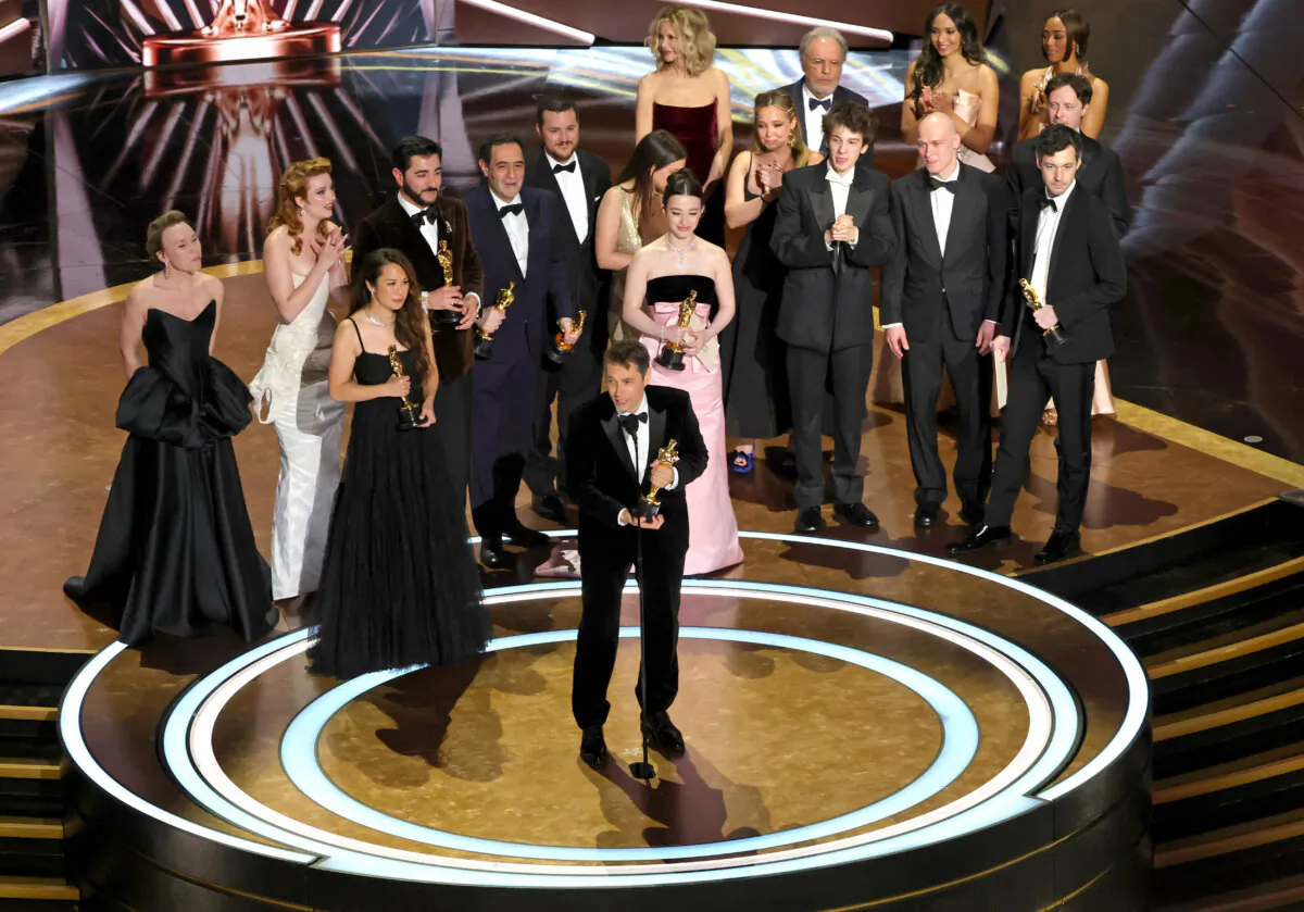 Cast and crew including Darya Ekamasova, Lindsey Normington, Vache Tovmasyan, Karren Karagulian, Alex Coco, Mikey Madison, Mark Eydelshteyn, Samantha Quan, Luna Sofía Miranda, Sean Baker, Drew Daniels, and Yura Borisov accept the Best Picture award for "Anora" onstage during the 97th Annual Oscars at Dolby Theatre in Hollywood, Calif., on March 2, 2025. (Kevin Winter/Getty Images)
