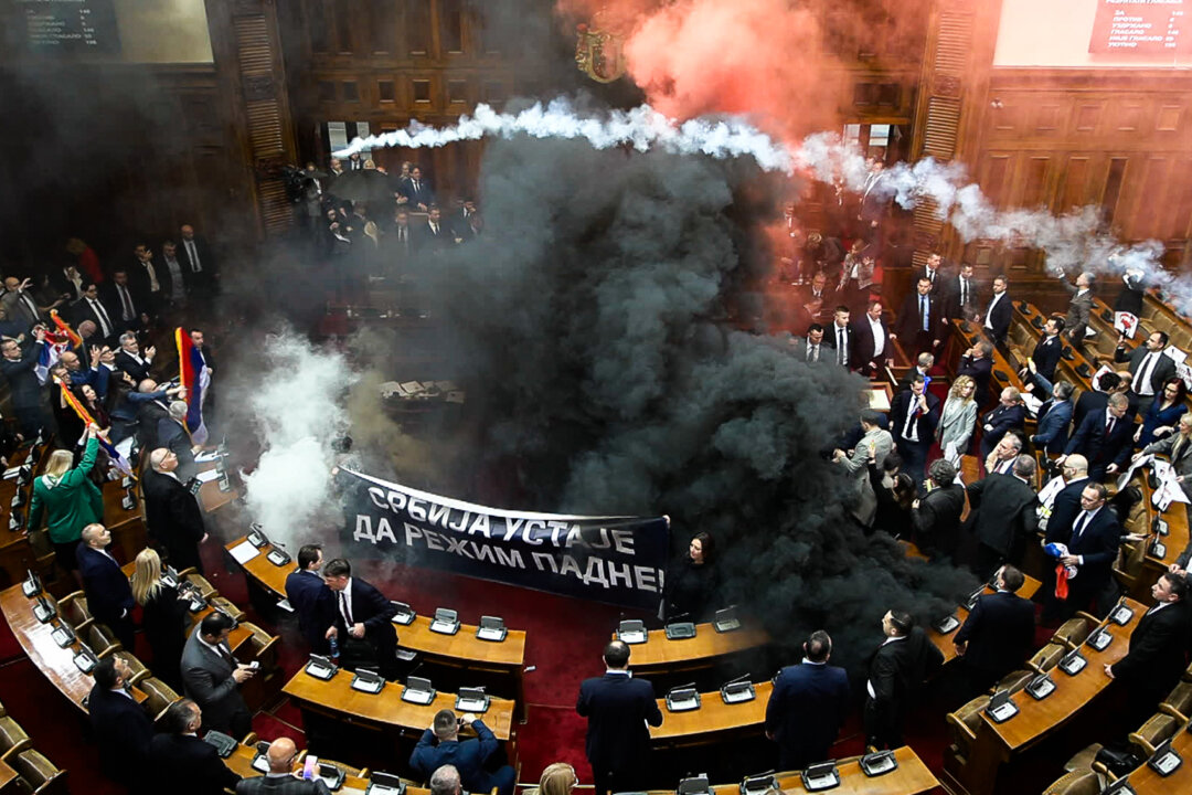 NextImg:Day in Photos: Chaos in the Serbian Parliament, Trump’s Tariffs Take Effect, and Pancake Race in London