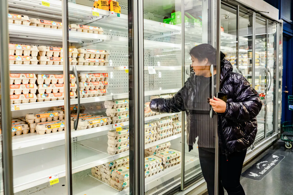 A woman looks at eggs at a store in New York City on Feb. 17, 2025. (Samira Bouaou/The Epoch Times)