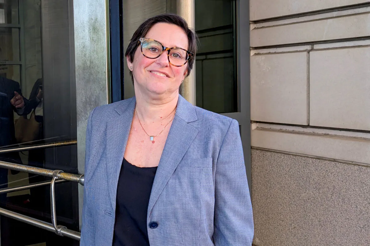 Cathy Harris of the U.S. Merit Systems Protection Board poses as she leaves the E. Barrett Prettyman U.S. Courthouse in downtown Washington on March 3, 2025. (Mike Scarcella/Reuters)