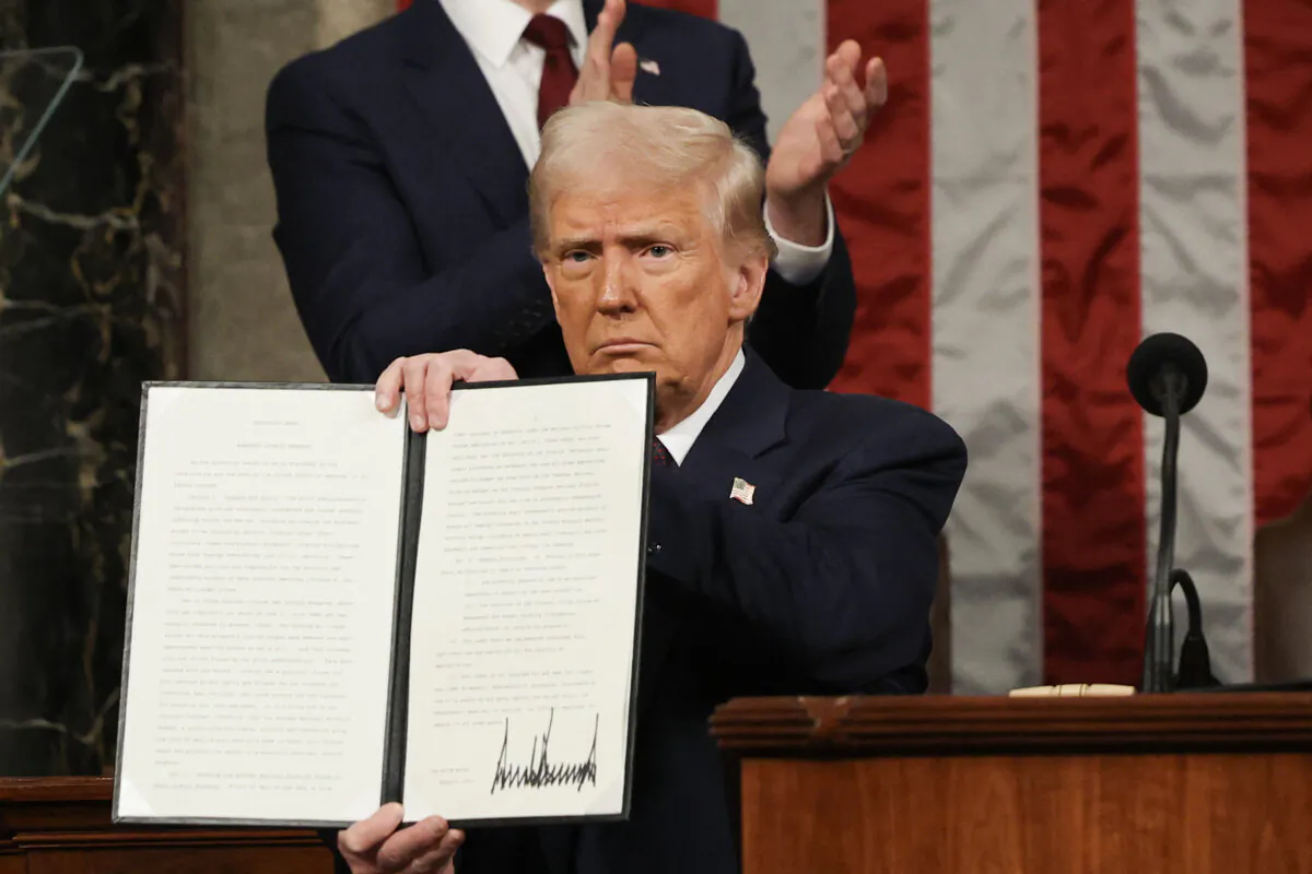 President Donald Trump holds an executive order that renames a wildlife sanctuary after Jocelyn Nungaray, in Washington on March 4, 2025. (Win McNamee/AFP via Getty Images)