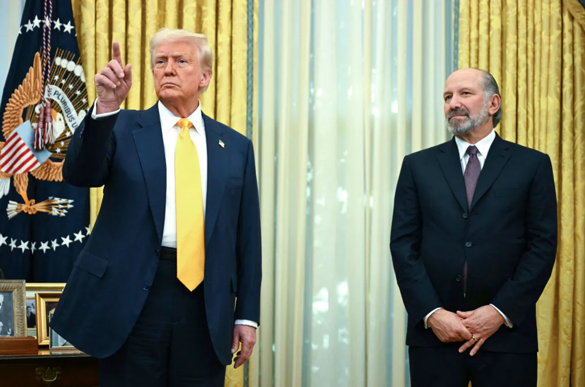 US President Donald Trump speaks during a ceremonial swearing-in for US Secretary of Commerce Howard Lutnick (R) in the Oval Office of the White House in Washington, DC, on February 21, 2025. (Photo by Jim WATSON / AFP)