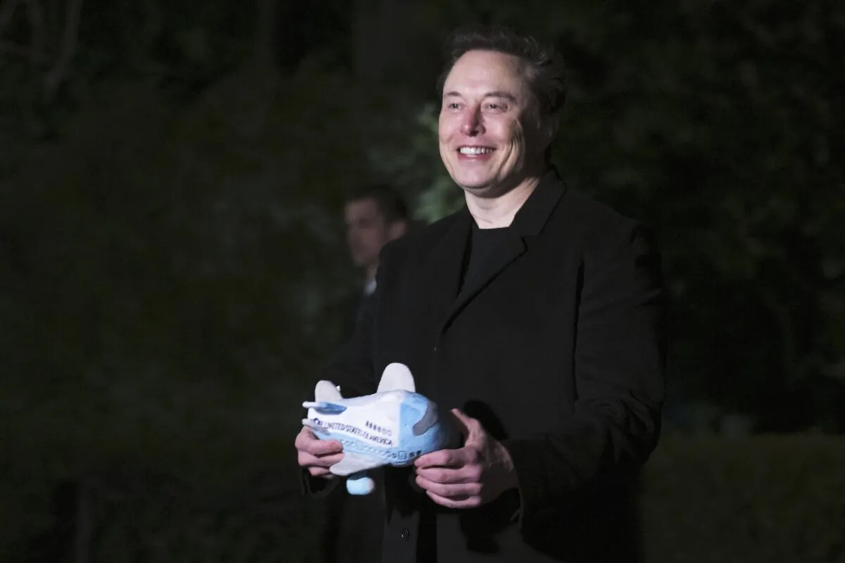 Tesla and SpaceX CEO Elon Musk holds a stuffed Air Force One toy after stepping off Marine One on the South Lawn of the White House in Washington on Feb. 19, 2025. (Jim Watson/AFP/Getty Images)