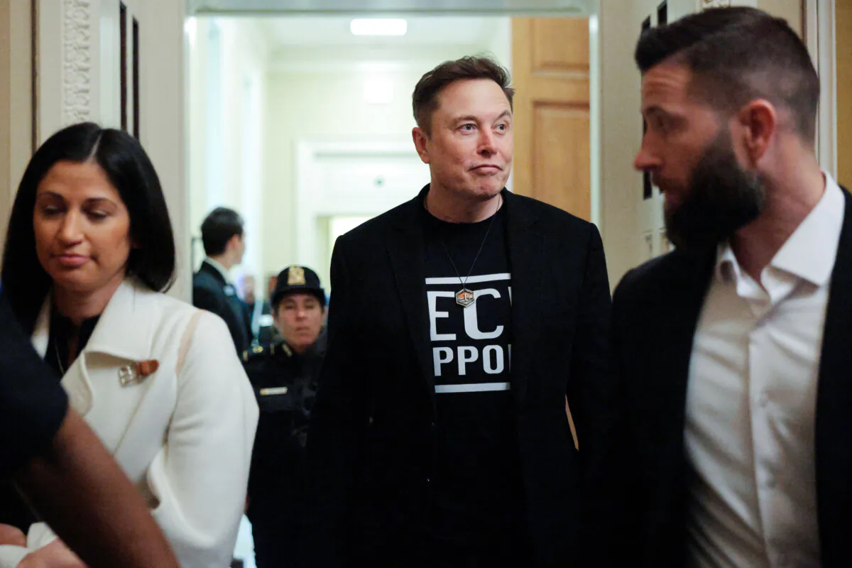 White House senior adviser to the president, Tesla and SpaceX CEO Elon Musk (C), is accompanied by Katie Miller (L) as he leaves a meeting with Senate Republicans in the U.S. Capitol on March 5, 2025. (Chip Somodevilla/Getty Images)