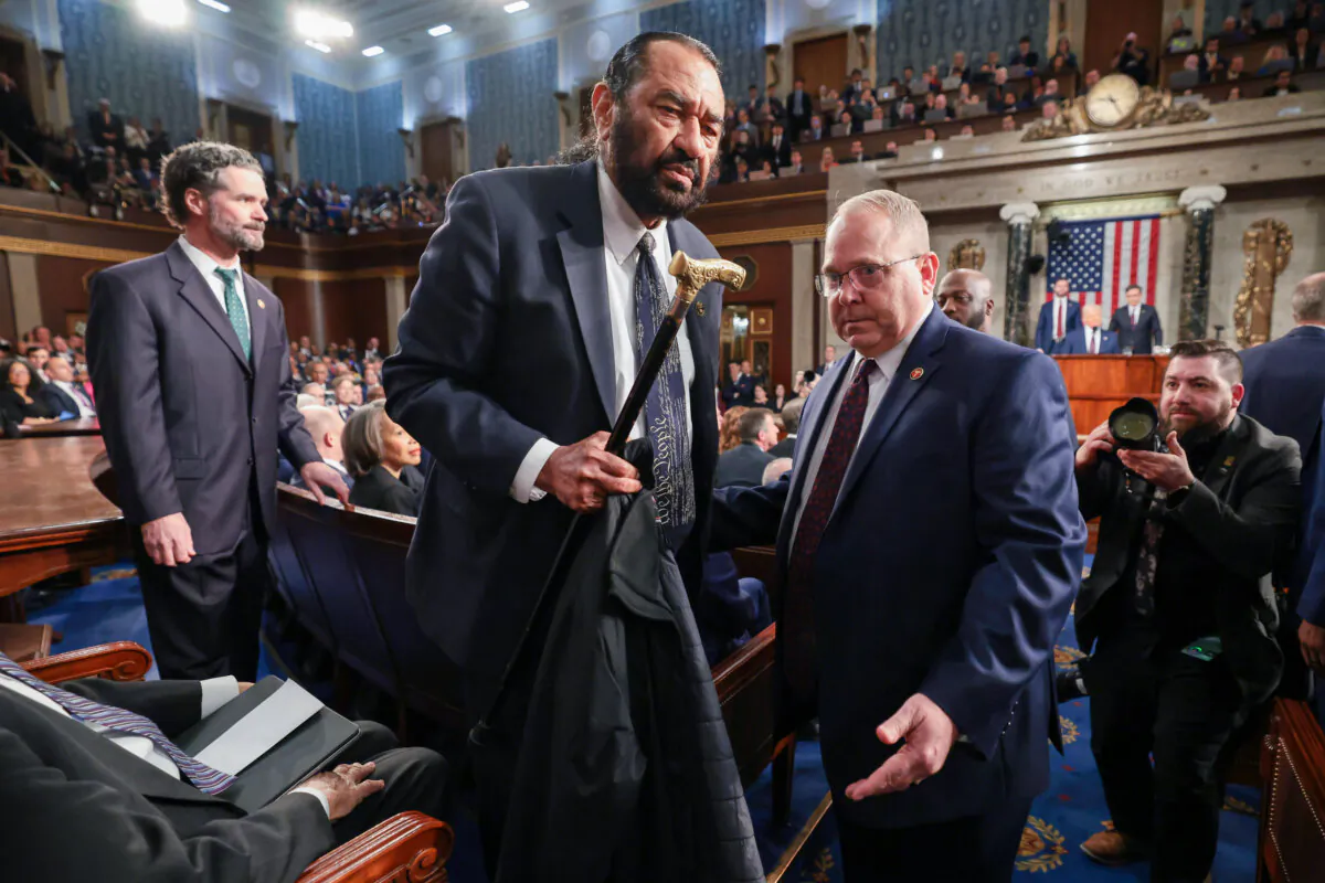 Rep. Al Green (D-Texas) is removed from the chamber as President Donald Trump addresses a joint session of Congress at the U.S. Capitol on March 4, 2025. (Win McNamee/Pool Photo via AP)