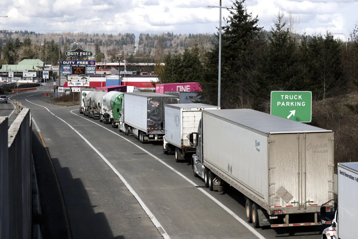 A line of trucks traveling into Canada at the Pacific Highway US-Canadian border crossing in Blaine, Wash., on March 5, 2025. (Jason Redmond/AFP via Getty Images)