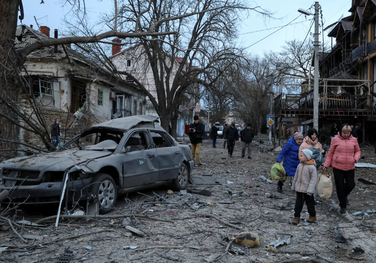 Residents leave apartment buildings hit by a Russian air strike in Kherson, Ukraine on Feb. 2, 2025. (Ivan Antypenko/Reuters)