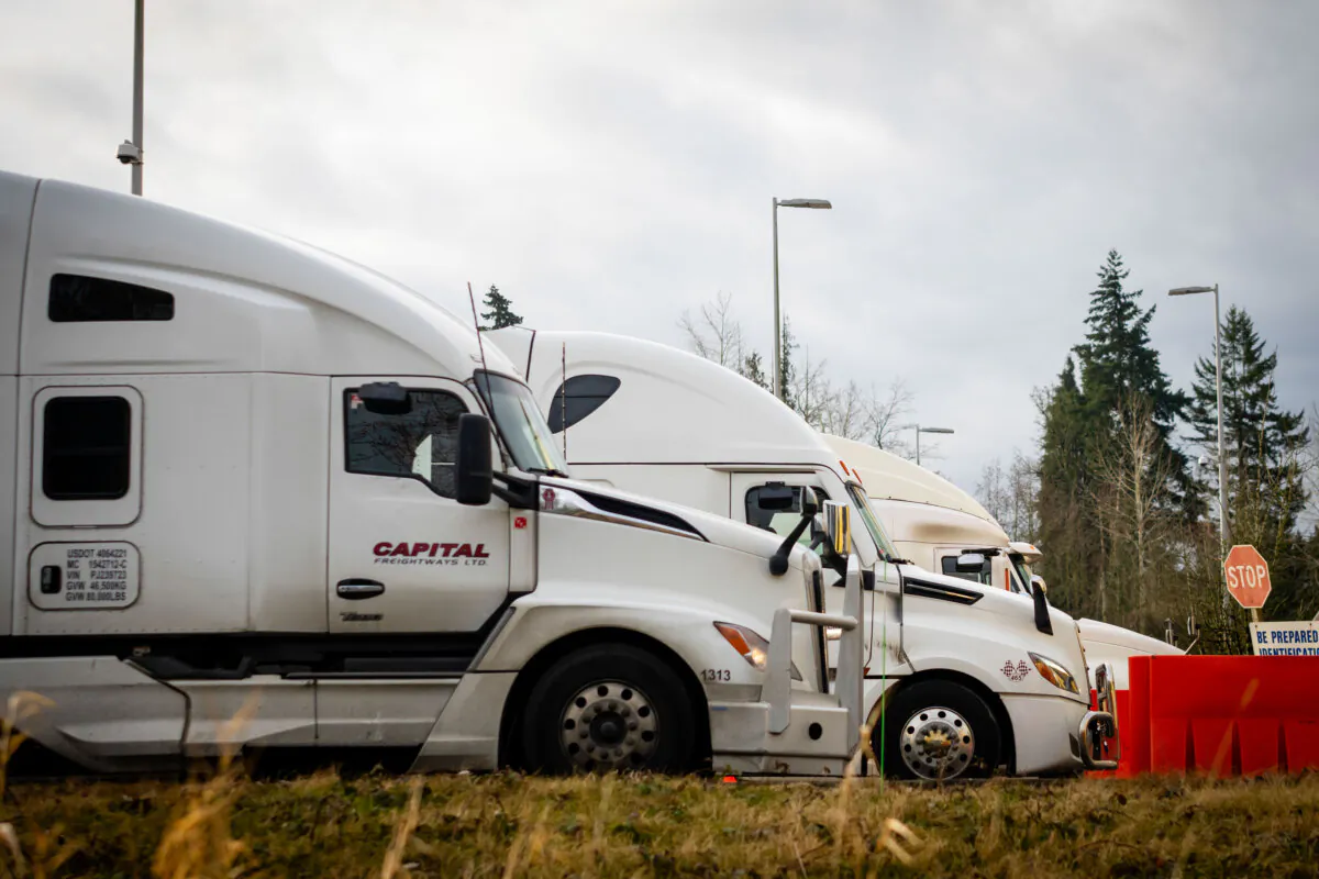 Trucks wait at the United States and Canada border in Surrey B.C., on March 4, 2025. (The Canadian Press/Ethan Cairns)