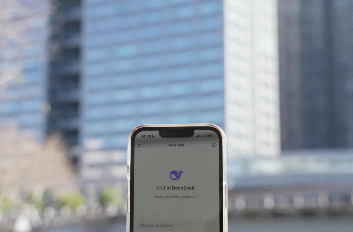 This photo illustration shows the DeepSeek app on a mobile phone in front of the building housing the headquarters of Chinese AI startup DeepSeek in Hangzhou, in China's eastern Zhejiang province on Jan.  28, 2025. (Agatha Cantrill/AFP via Getty Images)