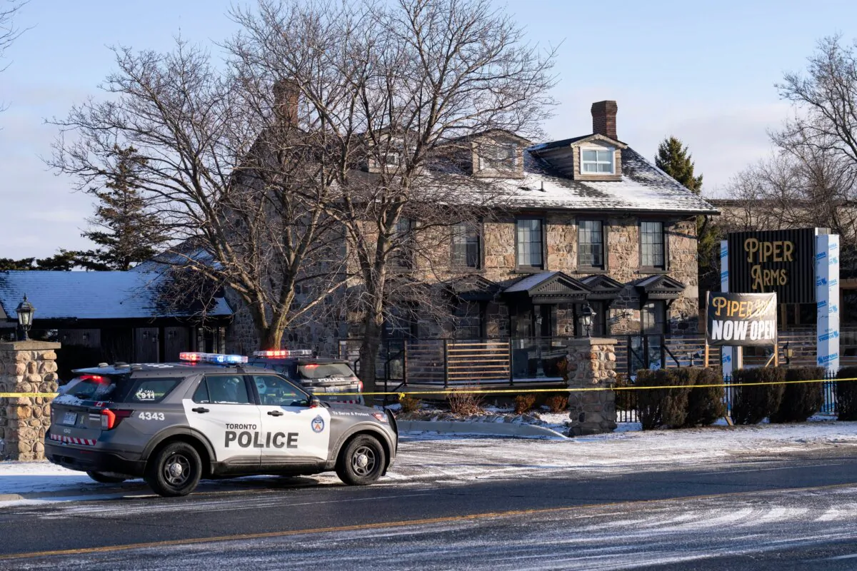 Police attend the scene of a shooting in Toronto on March 8, 2025. (Arlyn McAdorey/The Canadian Press via AP)
