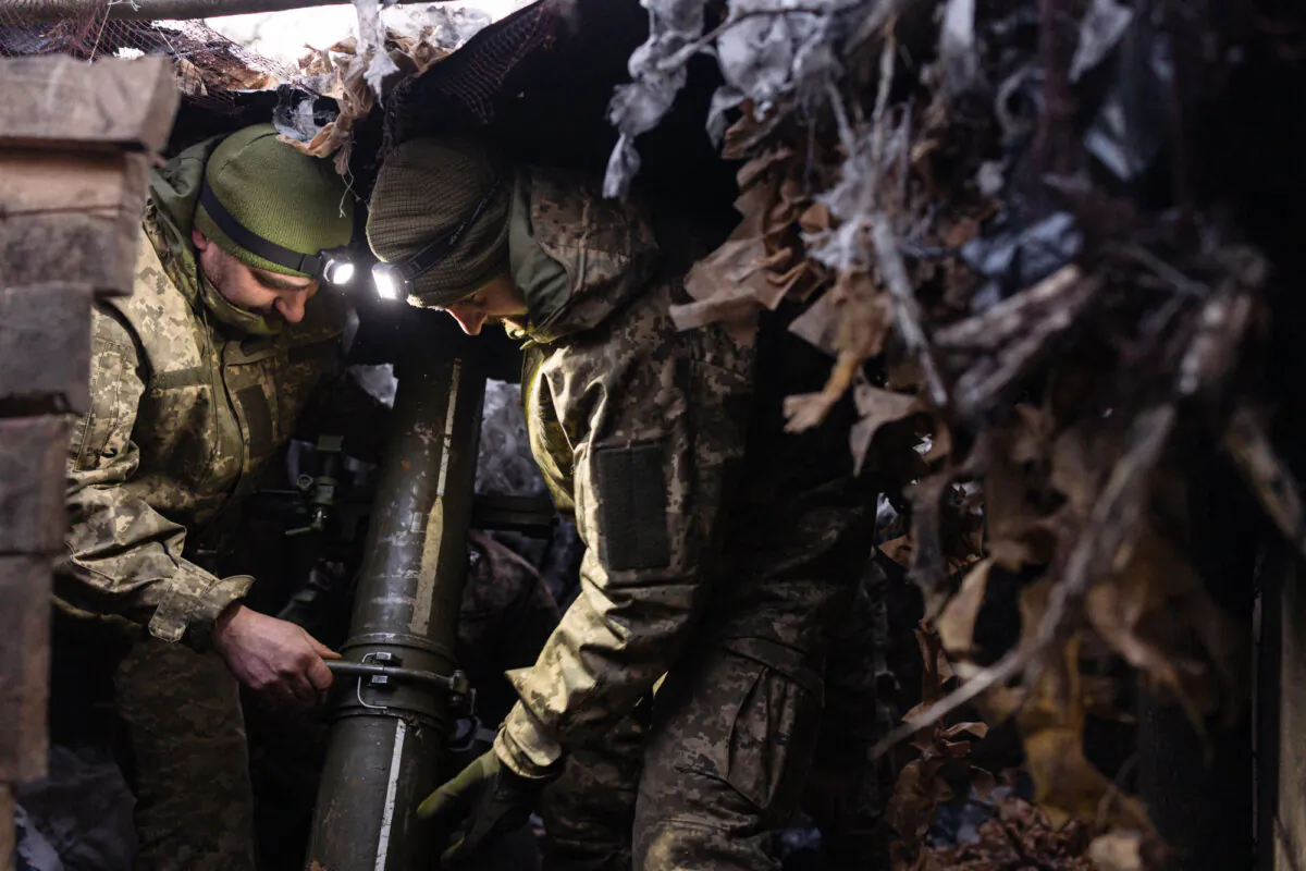 Ukrainian soldiers prepare to fire a mortar at Russian positions in Sumy, Ukraine, on March 9, 2025. (Diego Fedele/Getty Images)