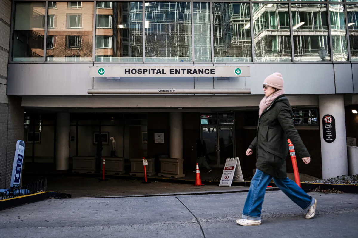 A woman walks by a hospital in Washington on Jan. 2, 2025. (Madalina Vasiliu/The Epoch Times)