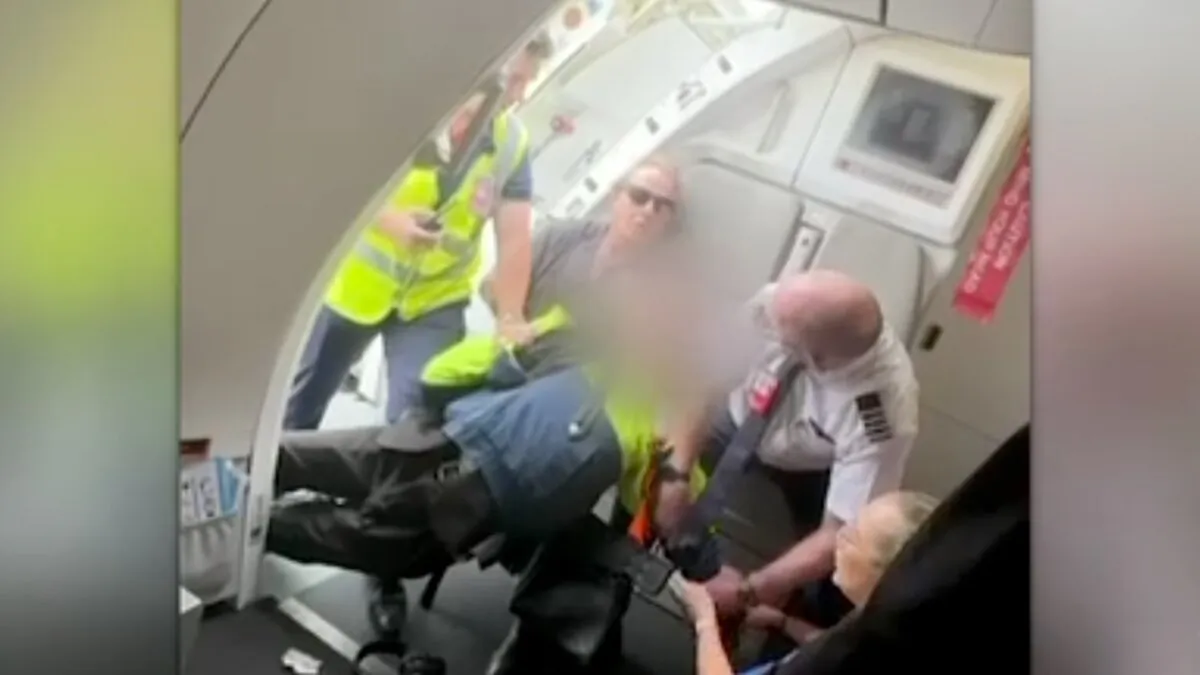 In a screenshot, a teenager allegedly attempts to board Jetstar flight with gun at Avalon Airport in Geelong, Victoria, Australia, on March 6, 2025. (AAP Image/Provided by 7News)