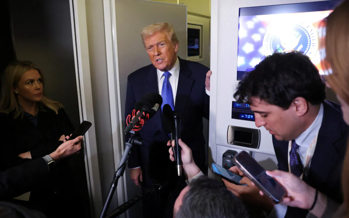 President Donald Trump speaks to reporters aboard Air Force One on his return to Washington, on March 9, 2025. (Kevin Lamarque/Reuters)