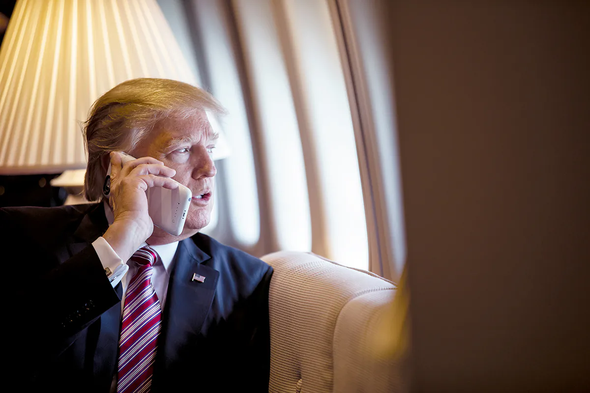 President Donald Trump talks on the phone aboard Air Force One during a flight to Philadelphia on Jan. 26, 2017. (Shealah Craighead/Official White House Photo)