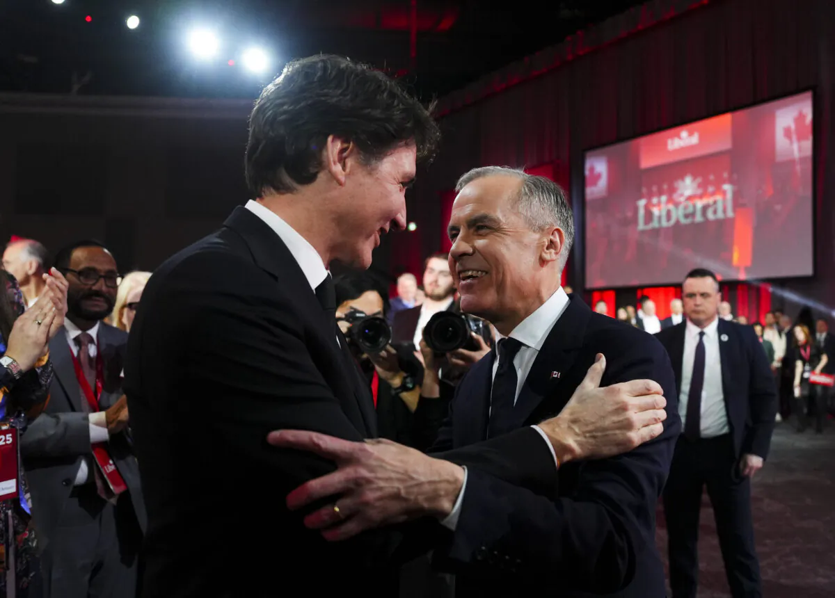 Liberal Leader Mark Carney (R) speaks to Prime Minister Justin Trudeau after Carney was announced as winner of the party leadership at the announcement event in Ottawa on March 9, 2025. (The Canadian Press/Sean Kilpatrick)