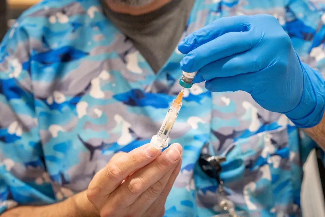 A provider prepares an MMR vaccine at a clinic in Lubbock, Texas, in a file photograph. (Jan Sonnenmair/Getty Images)