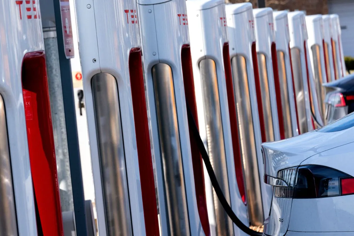 Vehicles sit at Tesla electric vehicle chargers in Springfield, Virginia, on March 15, 2022. (Stefani Reynolds/AFP via Getty Images)