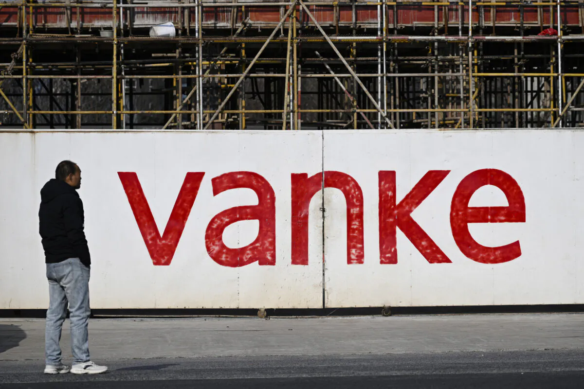 A man stands outside the construction site of a residential complex being built by Chinese real estate developer Vanke in Nanjing, Jiangsu Province, China, on Feb. 13, 2025. (AFP via Getty Images)