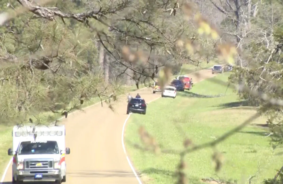 First responders work the scene after a medical transport helicopter crashed in Madison County, Miss., on March 10, 2025, in a still from video. (WAPT via AP)