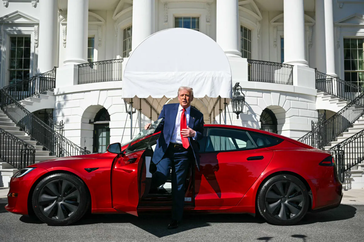 President Donald Trump speaks to the press as he exits a Tesla vehicle on the South Portico of the White House in Washington on March 11, 2025. (Mandel Ngan/AFP via Getty Images)