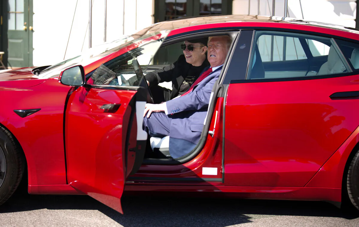 President Donald Trump and White House senior advisor, Tesla and SpaceX CEO Elon Musk sit in a Tesla Model S on the South Lawn of the White House on March 11, 2025. (Andrew Harnik/Getty Images)