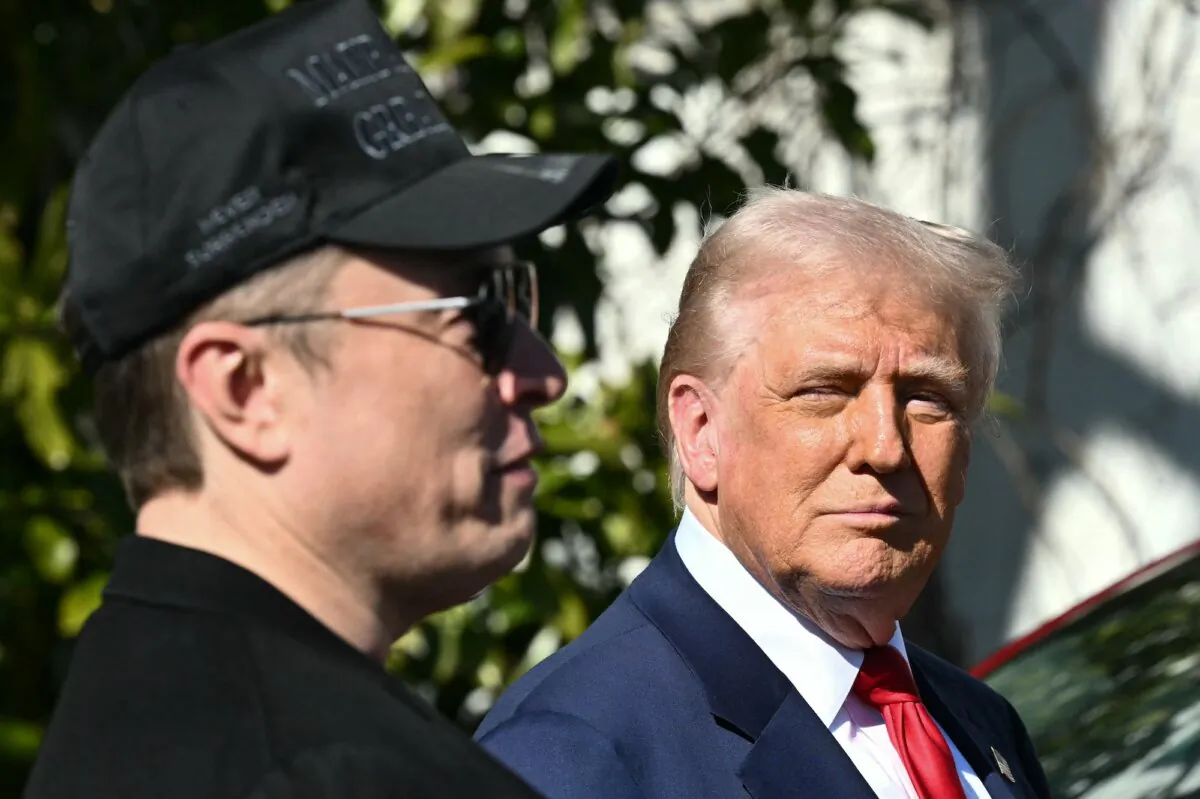President Donald Trump and Tesla CEO Elon Musk speak to the press outside the White House in Washington on March 11, 2025. (Mandel Ngan/AFP/Getty Images)