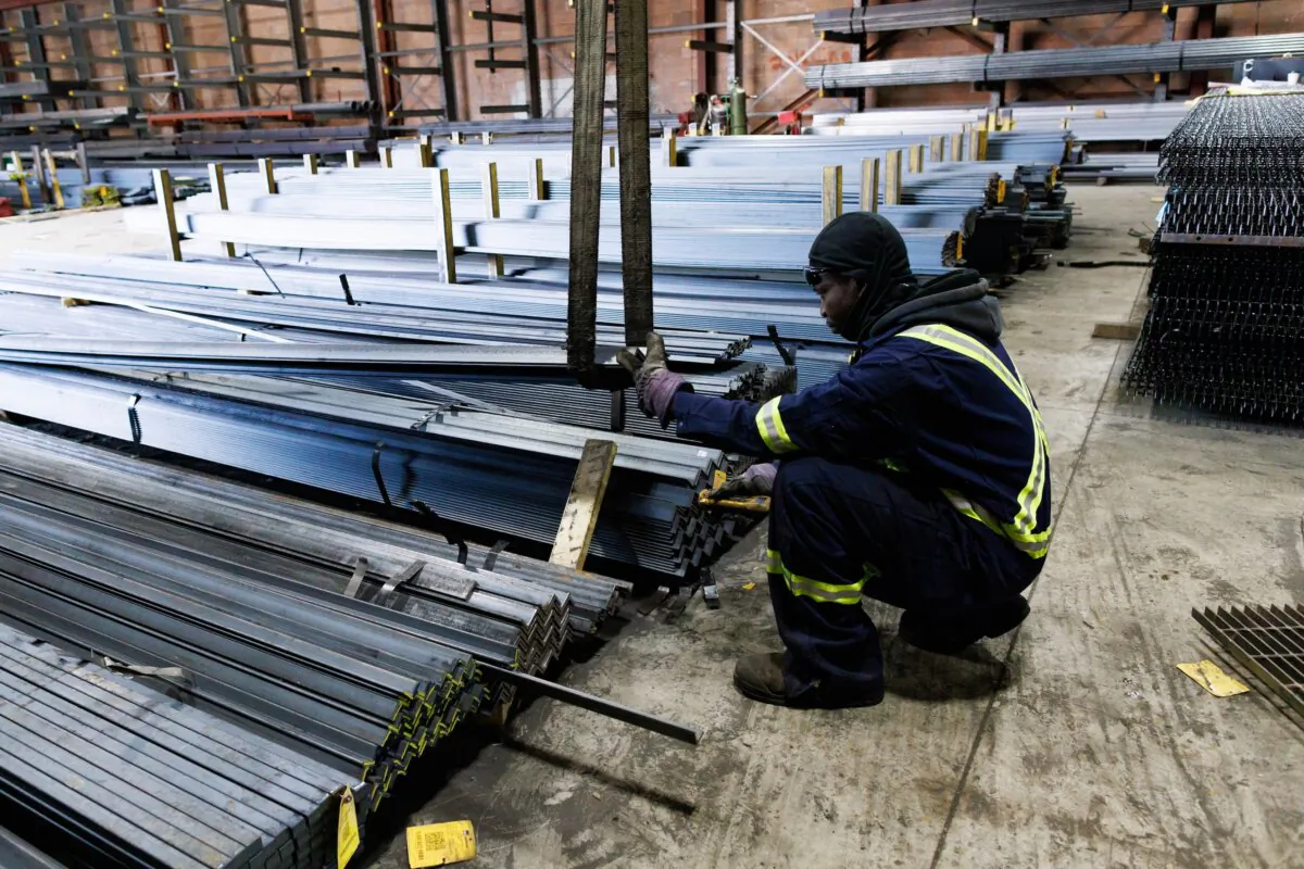A worker moves steel product at North York Iron, a steel supplier in Toronto, Ontario, Canada, on Feb. 11, 2025. (Cole Burston/AFP)