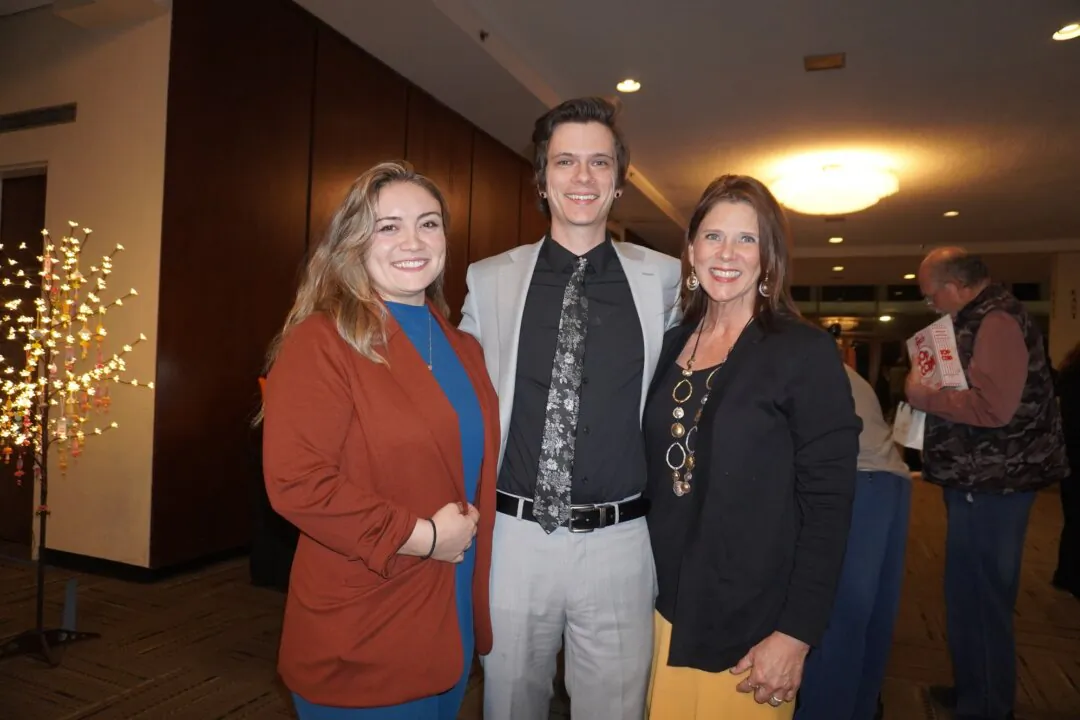 Samuel Diederich (C), Ariana Diederich, and Karen Diederich at the Shen Yun Performing Arts performance at Johnny Mercer Theatre at Savannah Civic Center on March 11, 2025. (Sherry Dong/The Epoch Times)