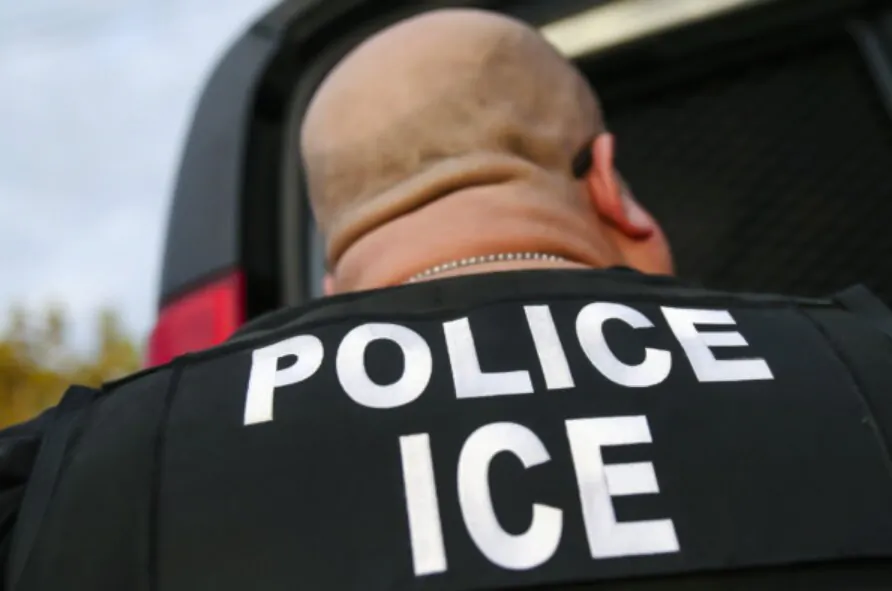 An Immigration and Customs Enforcement (ICE) agent detains an illegal immigrant, in this undated file photograph. (John Moore/Getty Images)