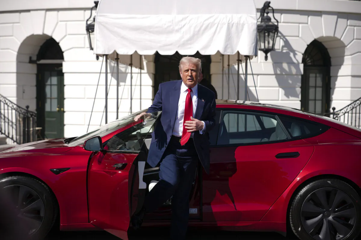 President Donald Trump gets out of a Tesla Model S on the South Lawn of the White House in Washington on March 11, 2025. (Andrew Harnik/Getty Images)