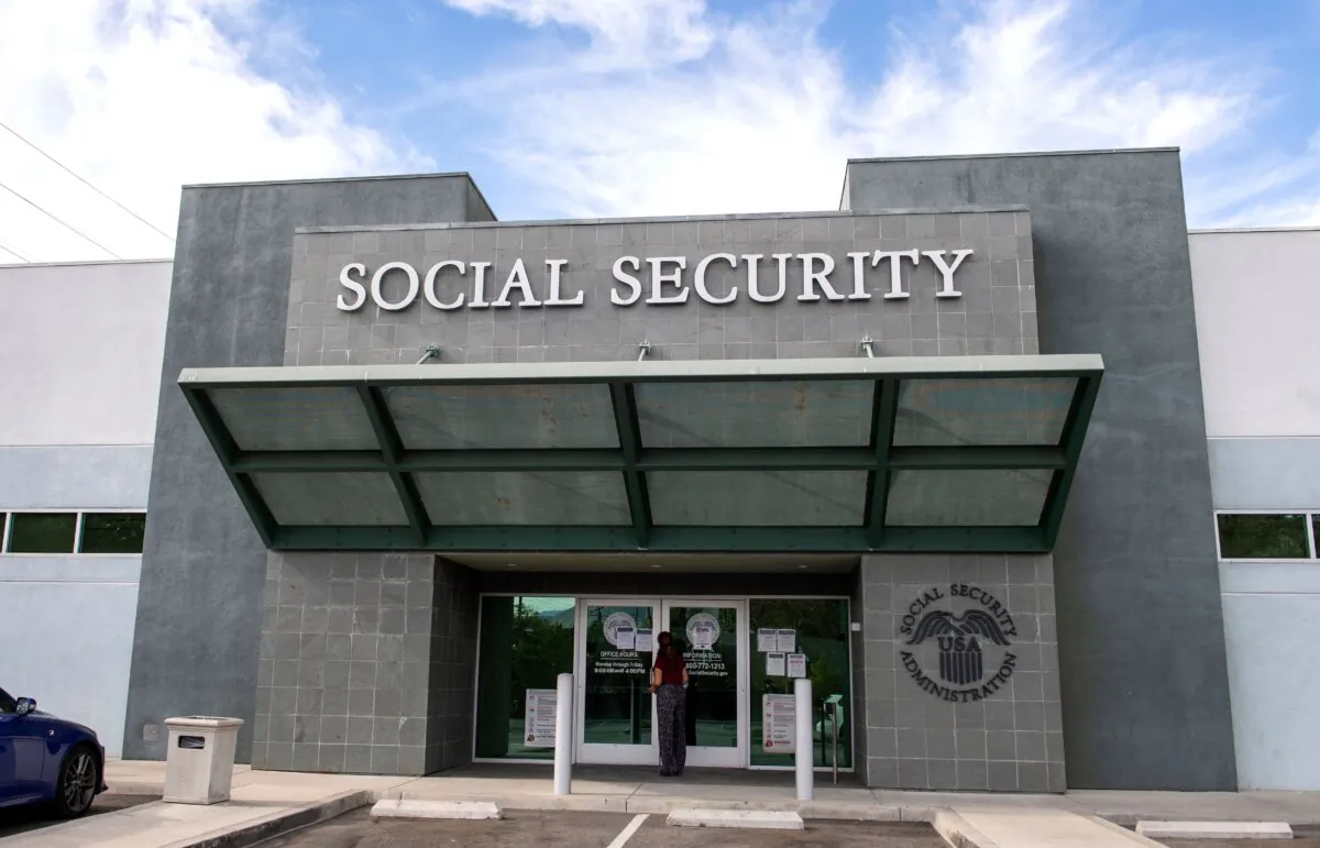 A woman stands outside a Social Security Administration building in Burbank, Calif., on Nov. 5, 2020. (Valerie Macon/AFP via Getty Images)