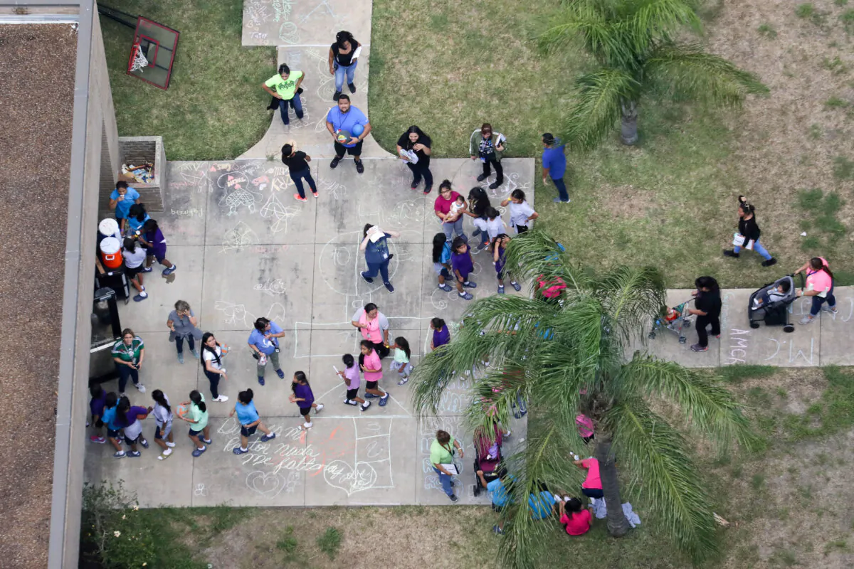 Illegal immigrant children make their way into a shelter for unaccompanied minors, in Brownsville, Texas on June 23, 2018. (Loren Elliott/Reuters)