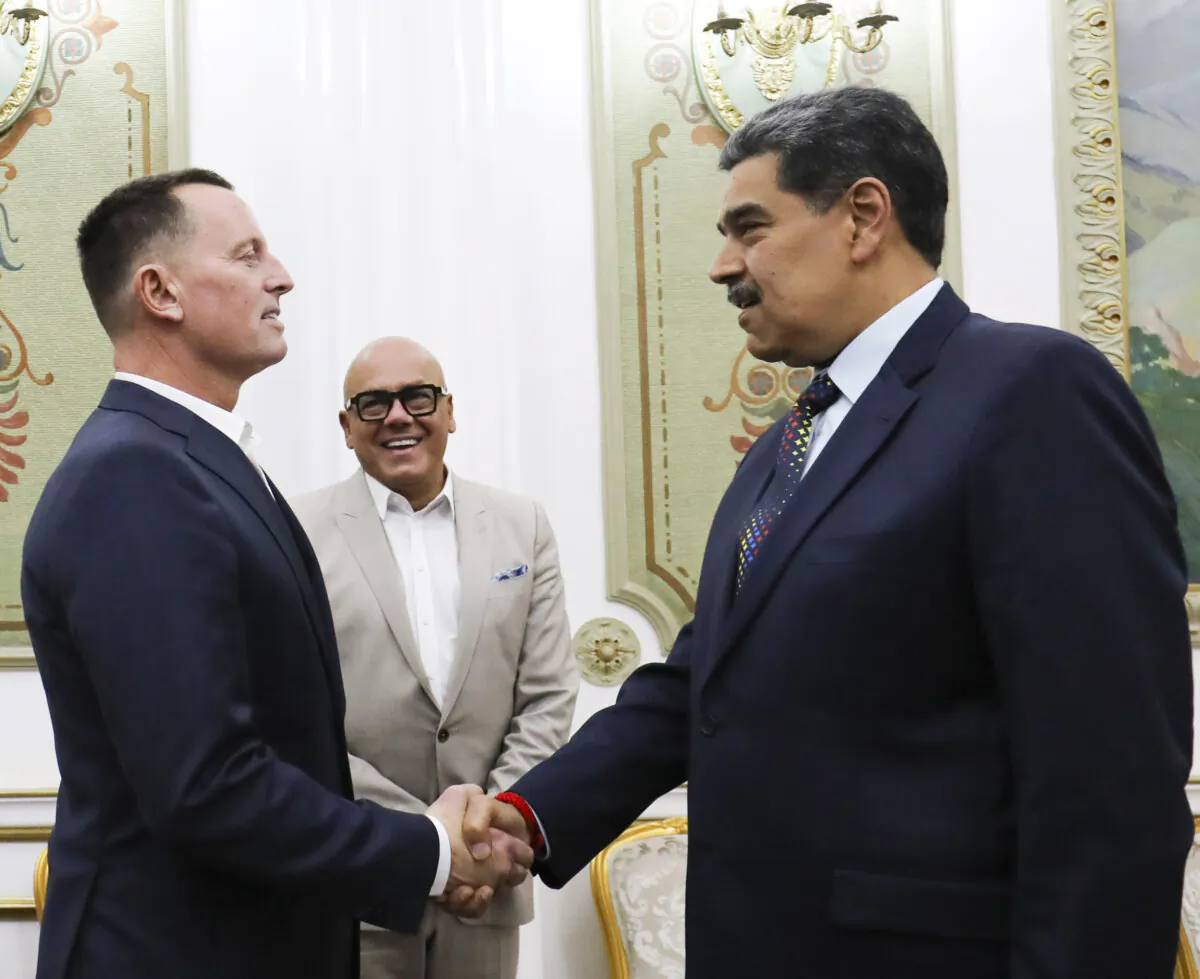 Venezuelan President Nicolas Maduro (R) shakes hands with Richard Grenell, President Donald Trump's special envoy, at Miraflores presidential palace in Caracas, Venezuela, on Jan. 31, 2025. (Venezuela's presidential press office via AP)