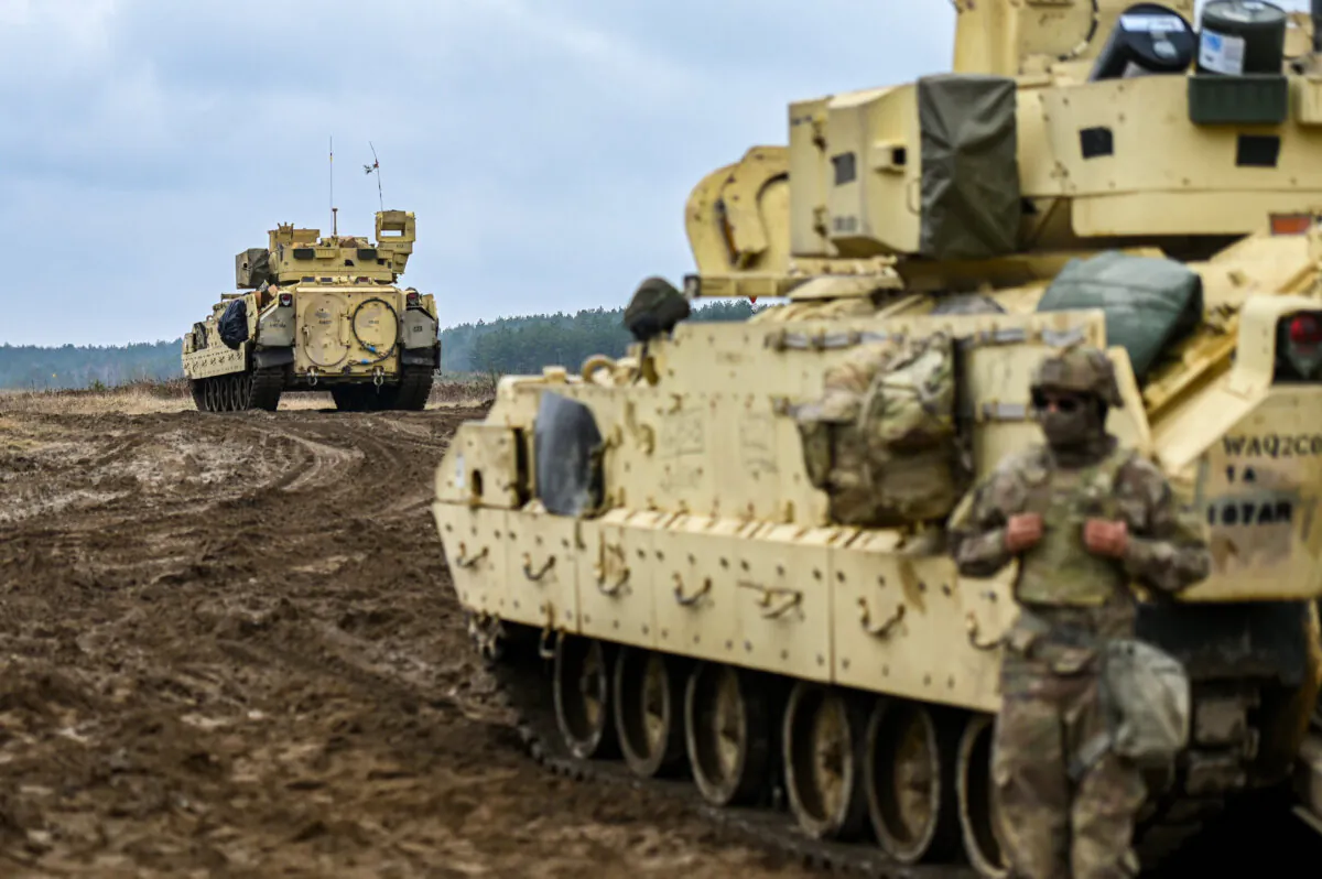 Soldiers of the U.S. Army 3rd Brigade, 1st Armored Division, and Bradley Fighting Vehicle prepare for a live fire exercise at the Drawsko Pomorskie training area in Drawsko Pomorskie, Poland, on March 13, 2025. (Omar Marques/Getty Images)