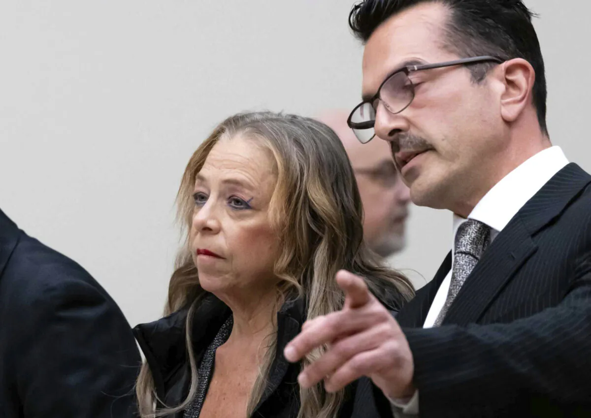 Kim Sullivan who is charged with neglect, stands with her attorney Ioannis Kaloidis (R) during her arraignment at Waterbury Superior Court in Waterbury, Conn., on March 12, 2025. (Jim Shannon/Hearst Connecticut Media via AP, Pool)